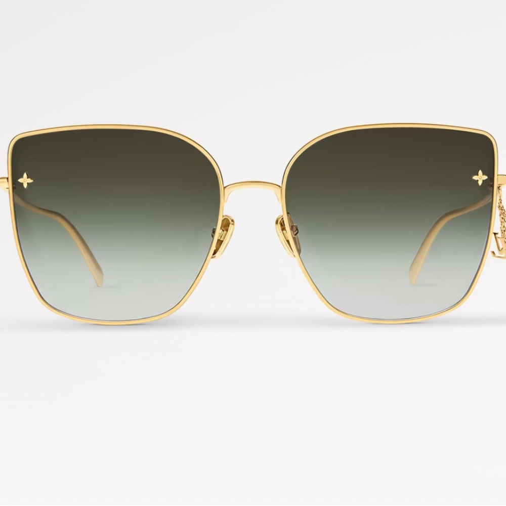 Louis Vuitton Gold and Black Cat Eye Sunglasses
With beautiful little charm .